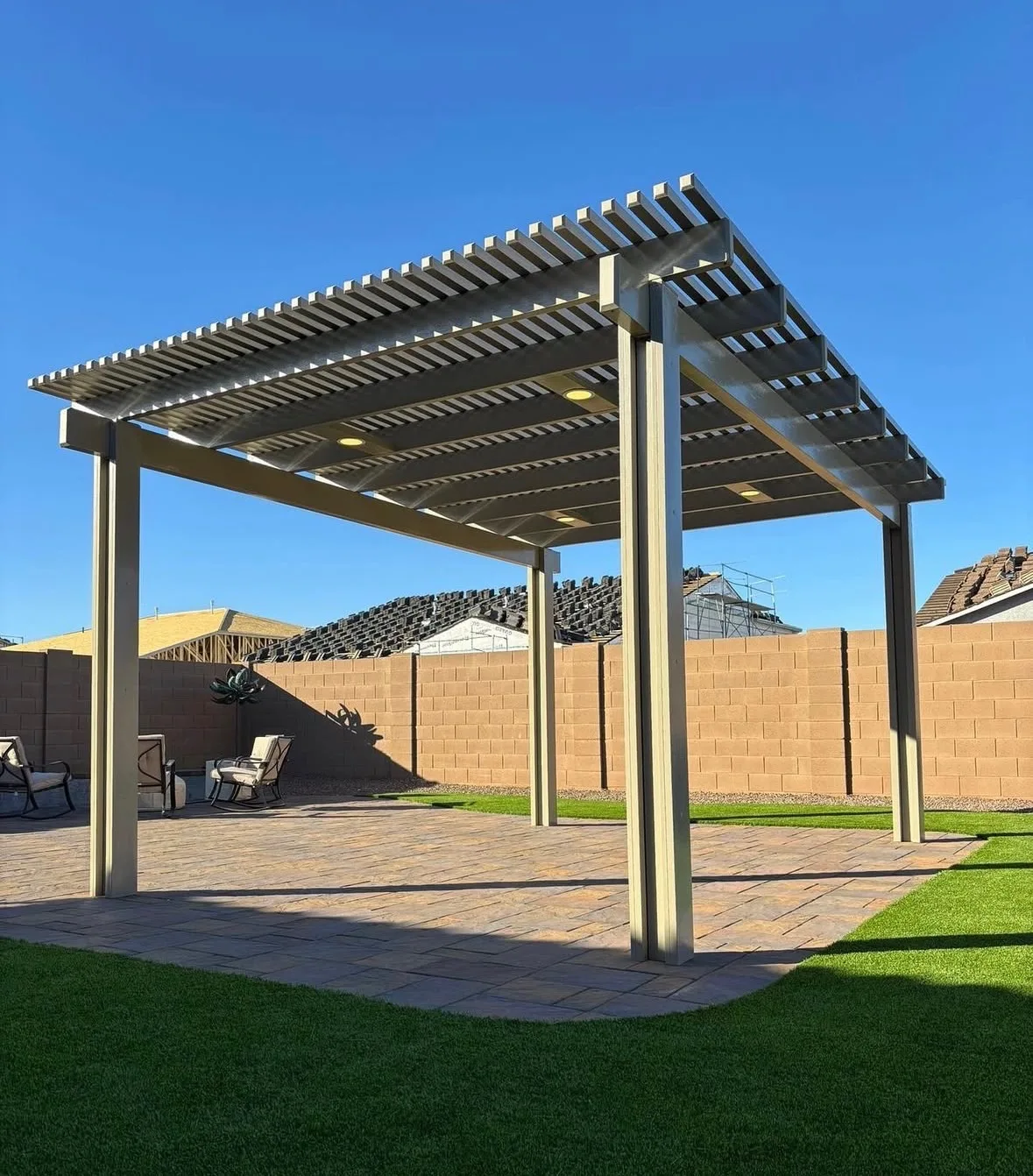 Pergola with slat roof and turf